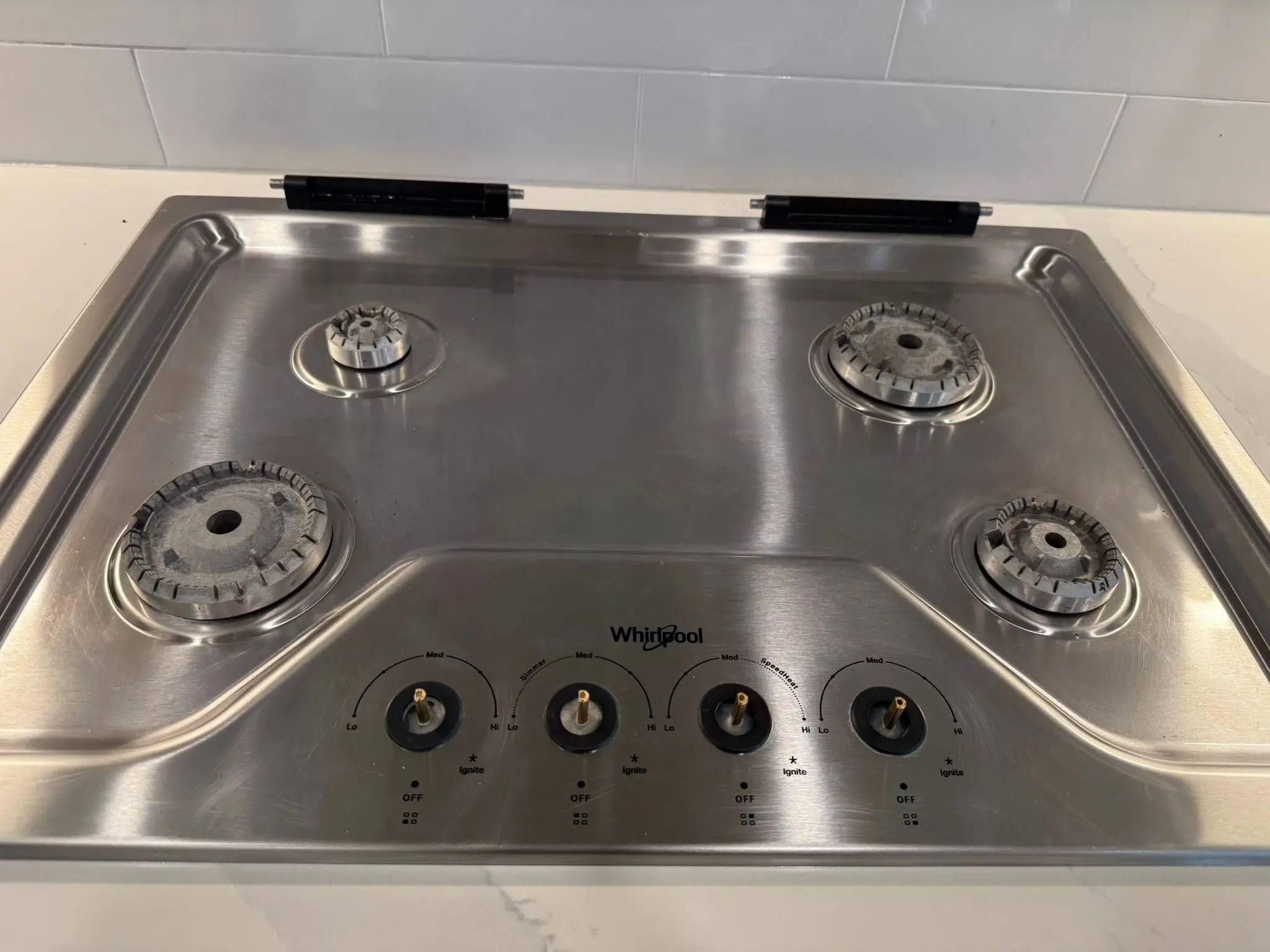 Stainless steel gas cooktop degreased and polished after appliance detailing