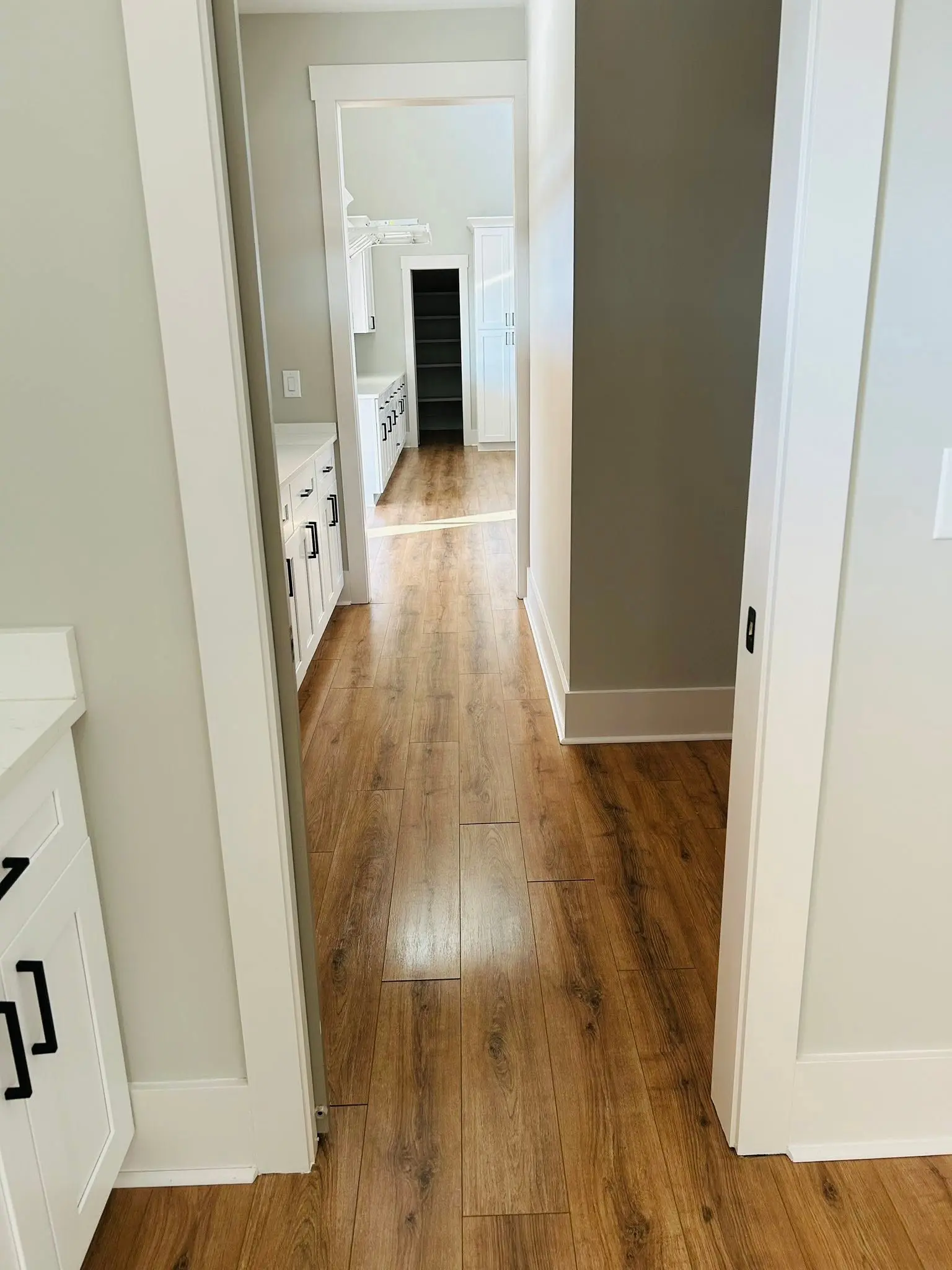 Hardwood hallway damp mopped to a soft sheen in a Peachtree City home